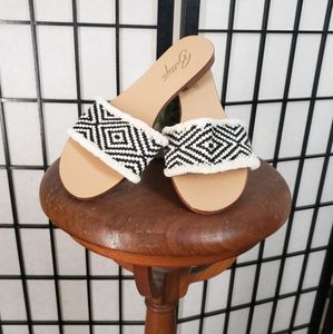 Woven slide sandals by Bettye